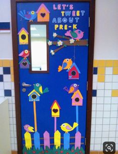 this door is decorated with colorful birds and birdhouses on the outside, along with words that read let's tweet about prek