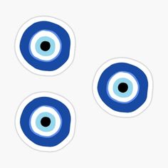 three blue eyeballs stickers on a white background with black dots in the center