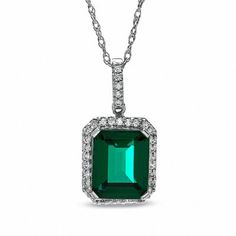 Regal and radiant, this exquisite fashion pendant was designed to captivate the May-born birthday girl. Crafted in fine sterling silver, the eye is drawn to the mesmerizing 10.0 x 8.0mm emerald-cut, lab-created green emerald center stone. A frame of shimmering lab-created white sapphires surrounds the gemstone and adorns the bale. Buffed to a brilliant shine, this pendant suspends from an 18.0-inch rope chain that secures with a spring-ring clasp. Green Topaz, Cleaning Silver Jewelry, Sapphire Earrings Studs, Green Things, Sapphire Studs, Lab Created Emerald, Green Chalcedony, Gem Ring, Emerald Necklace