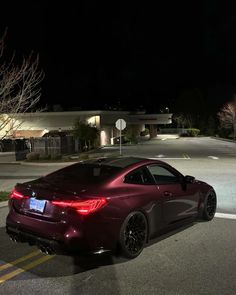 a car is parked on the street at night