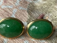 Estate/ Vintage Polished 14KT Yellow Gold Oval, Genuine, Cabochon, Bezel-Set, Green Jade Omega Back Earrings. Measures: 18 mm x 12 mm Weight: 3.70 g Omega Back Closure Stamped 14K Excellent estate condition! Beautiful bright green color! Wear them by themselves or interchange earring charms in them! Earring charms shown are an example + sold separately. Check out all our omega back earrings + our entire jewelry collection! Please let us know if you have any questions. International buyers: you a Classic Oval Clip-on Earrings For Formal Occasions, Green Oval Earrings For Formal Occasions, Classic Green Clip-on Earrings For Formal Occasions, Oval Cabochon 14k Gold Earrings, Classic Oval Clip-on Earrings With Polished Finish, Classic Lime Green Oval Jewelry, Heirloom Green Oval Cabochon Jewelry, Elegant Green Oval Clip-on Earrings, Classic Oval Cabochon Clip-on Earrings