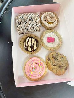 a box filled with lots of different types of cookies