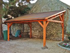 an old stone building with a wooden roof