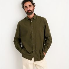 As The Name Implies, Alex Mill's Best-Selling Shirt Is Incredibly Easy To Wear With A Slightly Oversized Fit. Made In Alex Mill's Signature Garment-Dyed Paper Poplin That's Both Lightweight And Crisp. Has A Way Of Looking Even Better The More Rumpled Up It Is (Again, Easy). We Love It Over Jeans, Half-Tucked Into Chinos, Or Layered Under Sweaters And Blazers. Solid Olive Green Color. Point Collar. Button Front Closure. Button Cuff Sleeves. Single Chest Pocket. Back Yoke. Intentionally Oversized Fit. Stretch Cotton Poplin Fabrication. Color: Military Olive Size Small Measures Flat Approximately: 22.25" Pit To Pit, 32" Long In Back 98% Bci Cotton / 2% Elastane Machine Washable **B Classic Unstructured Khaki Shirt, Casual Long Sleeve Poplin Top, Casual Cotton Dress Shirt With Pockets, Casual Green Cotton Dress Shirt, Casual Dress Shirt With Relaxed Fit For Everyday, Green Shirt With Pockets For Everyday, Green Cotton Dress Shirt For Work, Casual Relaxed Fit Dress Shirt For Everyday, Everyday Green Shirt With Pockets