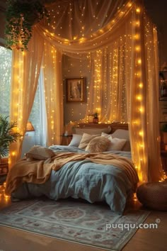 a bed with lights hanging from it's headboard and pillows on the floor