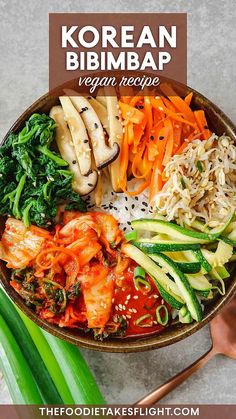 korean bibimbap with broccoli, carrots and noodles in a bowl