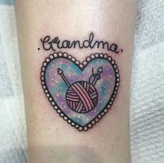 a heart shaped tattoo with a ball of yarn in the shape of a heart that says grandma