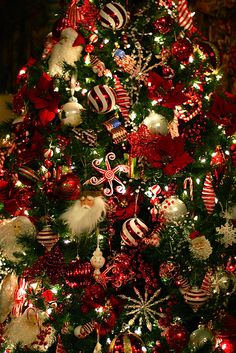 a christmas tree decorated with red and white ornaments