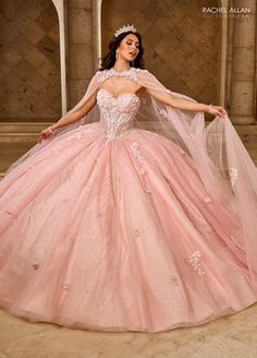 Make an impact in this embroidered applique long strapless cape dress with A-line skirt by Rachel Allan RQ1162. The sweetheart bodice, intricately beaded and adorned with shimmering appliqué details, enhances your natural elegance. With a detachable bodice liner, this gown is perfect for quinceañeras or grand celebrations, ensuring you radiate grace and beauty on your special day. Strapless Cape Quinceanera Dress by Rachel Allan RQ1162 Rachel Allan Carmina Collection: Spring 2025 Style Number: R Quinceanera Dresses Light Pink, Quinceanera Dresses With Cape, Quince Photoshoot, Strapless Ball Gown, Long Ball Gown, Tulle Applique, Quinceñera Dresses, Debutante Ball, Long Cape