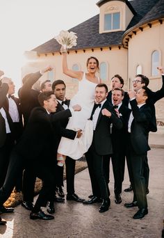 a bride and groom are surrounded by their wedding party