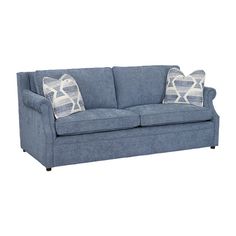 a blue couch with two pillows on it