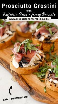 small appetizers are arranged on a wooden cutting board