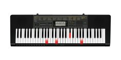 the electronic keyboard is black and white with red knobs on it's keys