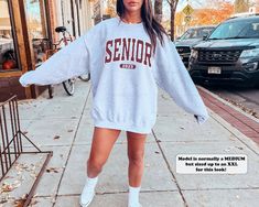 This preppy senior sweatshirt is the perfect gift for teenage girls in the Class of 2023! Featuring a crewneck style and a fun coconut girl aesthetic, this athletic school spirit shirt is sure to show off your Senior 2023 pride. ⭐️ * I T E M * I N F O* ✦ Gildan Unisex Sweatshirt ✦ This is made from a cozy, thinner material- perfect year round! ✦ Printed using Direct To Garment style- Inks are printed directly into the fabric. ✦ Different sizing may effect placement of final design. ✦ Colors may Jumper Men, Funny Sweater, Funny Sweaters, Oversized Look, Mom Sweatshirt, Digital Nature, Pullover Shirt, Look At You, Sew-in Labels