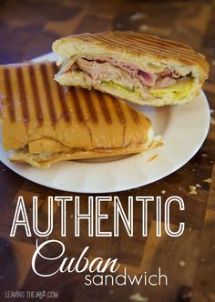 a sandwich cut in half on a plate with the words authentic cuban sandwich below it