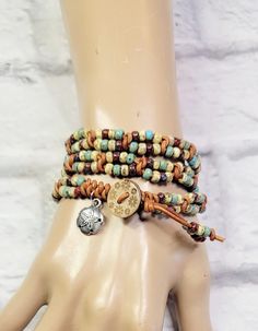 This beautiful beaded leather double wrap bracelet features seed beads in a picasso finish. They were hand woven onto high quality, premium leather. It was finished with a wood button with flowers burned on the button. It measures 22 inches to the loop.  What a great bracelet to wear with your favorite t-shirt, jeans and boots! Please measure your wrist carefully. This wrap bracelet is meant to wrap around your wrist three times.  Please Note - Due to the differences in computer monitors and cel Bohemian Beaded Leather Wrap Bracelet, Brown Hand Wrapped Beaded Bracelets For Festivals, Bohemian Adjustable Hand Wrapped Leather Bracelet, Hand Wrapped Brown Beaded Bracelets For Festivals, Multicolor Beaded Spiritual Leather Bracelet, Bohemian Brown Leather Bracelet Hand Wrapped, Bohemian Hand Wrapped Brown Leather Bracelet, Bohemian Hand Wrapped Leather Wrap Bracelet, Brown Leather Beaded Bracelets For Festival