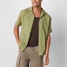 Embrace a laid-back vibe with this Jaywalker men's textured button-down shirt in a green hue. It's crafted from 100% cotton for all-day comfort and has a relaxed-fit, a notch collar, and short sleeves. Wear yours with cargo pants and sneakers. Closure Type: ButtonFit: Relaxed FitNeckline: Collar NeckSleeve Length: Short SleeveApparel Length: 27.5 InchesFiber Content: 100% CottonFabric Description: WovenCollar: Notch CollarCare: Machine Wash, Tumble DryCountry of Origin: Imported Cream Shorts, Notch Collar, Large Shirts, Green Button, Button Front Shirt, Short Sleeve Button Up, Shirt Color, Men Short Sleeve, Cargo Pants