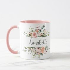 a pink and white coffee mug with the name anabella on it