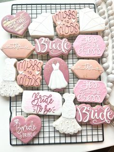 decorated cookies on a cooling rack for brides and grooms to share with each other