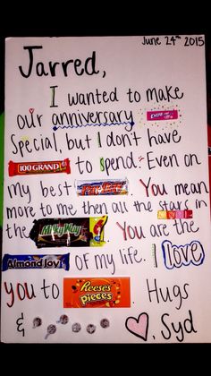 a handwritten note written on a white board with candy bars and candies in it