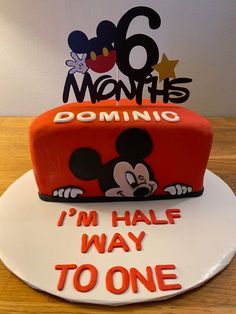 a birthday cake that is shaped like mickey mouse