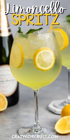 two glasses filled with lemonade spritz on top of a table