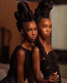 two black women with braids in their hair