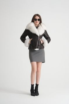 Indulge in luxury with our women's genuine leather jacket, featuring a sumptuous fox fur collar and cuffs, and a soft sheepskin lining. Designed to keep you warm even in the coldest weather, this 65 cm (approximately 26 inches) jacket ensures maximum comfort and style. The oversized fox fur collar adds a touch of elegance, while the belted design offers a flattering fit. Perfect for any winter occasion, this jacket will keep you warm and stylish all season long. Jacket With Fur Collar And Cuffs, Chic Shearling Leather Jacket With Faux Fur Trim, Classic Leather Jacket With Faux Fur Trim For Fall, Classic Fitted Leather Jacket With Faux Fur Lining, Luxury Winter Biker Jacket With Faux Fur Trim, Fitted Leather Fur Coat With Faux Fur Lining, Fitted Shearling Leather Jacket With Faux Fur Trim, Classic Leather Jacket With Faux Fur Trim For Winter, Luxury Sheepskin Leather Jacket With Faux Fur Lining