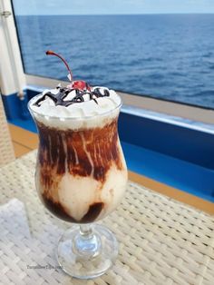 an ice cream sundae is on the deck of a cruise ship in the ocean