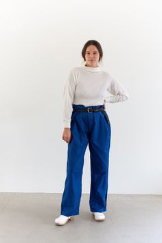 "These high waist pants have a 5-button fly, no pockets, waist tab adjusters. Maker: Military Made in the USA in 1950s | Material: 100% Cotton - warm weather weight - unlined. Condition: Excellent. Washed Deadstock. Measurements: Waist: 33-41\" with waist tab adjusters - 3 buttons on each side | Hips: 48\" at widest | Rise: 13\" | Inseam: 31\" | Thigh: 14.5\" flat | Leg Opening: 9.75\" Liv is 5'7\" and wears 8 in modern pants with 30-31\" waist and 39\" hips. These could fit a larger frame. Liv Matisse Blue, Blue Chinos, Workwear Trousers, High Waist Pants, Cotton Pants, Waist Pants, Bright Blue, High Waisted Pants, Warm Weather