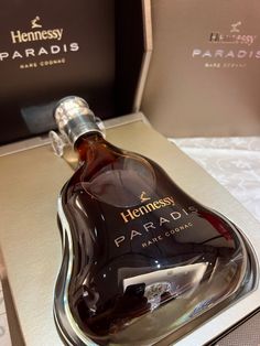 a bottle of henness parfais in a box