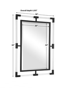 a mirror that has measurements for the frame and its width is shown in black and white