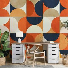 a room with an orange, blue and white wallpaper that has circles on it