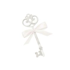 a white key with a bow on the front and back of it's handle