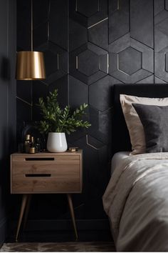 Modern bedroom with black geometric accent wall, wooden nightstand, gold lamp, and a potted plant. Black Bedroom Accent Wall, Gold Textured Wallpaper, Bedroom Accent Wall Ideas, Striped Accent Wall, Black Walls Bedroom, Black Hexagon Tile, Black Floral Wallpaper