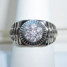 This Beautiful Men's Rolex Style Fashion Ring Has 7 Round Clear Cubic Zirconia Stones In The Center Making A Cluster. Its 11.2 (Mm) Wide At Its Widest Point. This Ring Is Stamped 925 And Has A Rhodium Finish For Greater Shine And Durability. If You Don't See The Size You Want Please Contact Me And I Will See If I Can Order One For You, This Ring Comes In Sizes 8-13. Nwot Classic Silver Signet Ring With Cubic Zirconia, Silver Signet Ring With Diamond Cut Cubic Zirconia, Silver Cubic Zirconia Signet Ring For Formal Occasions, Silver Cubic Zirconia Signet Ring With Diamond Cut, Classic Silver Signet Ring With Prong Setting, Skull Belt Buckle, Metal Skull, Solid Gold Bracelet, Gold Rope Chains