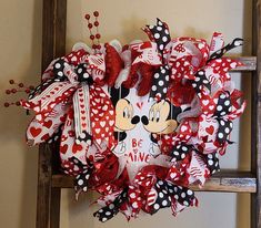 a minnie mouse wreath hanging on the wall