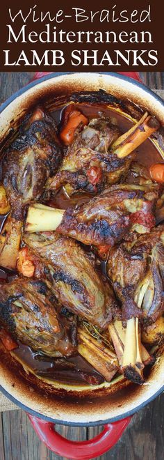 a red pot filled with meat and vegetables