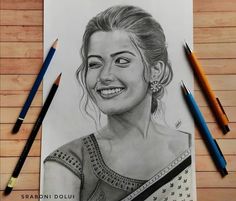 a pencil drawing of a smiling woman