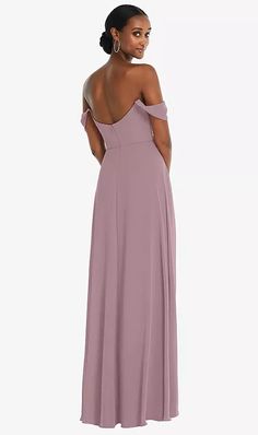 a woman in a long purple dress with one shoulder and open back, looking off to the side