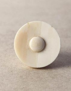 a small white object sitting on top of a table