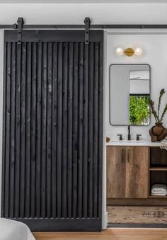 an open sliding door in a bathroom next to a sink