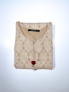 3/4 sleeves shirt with embroidery on sleeves and pockets. 1 piece Fitted Cotton Kurta With 3/4 Sleeves, Beige Long Sleeve Tops For Festive Occasions, Festive Long Sleeve Beige Top, Beige Long Sleeve Embroidered Kurta, Elegant Cotton Straight Kurta Top, Casual Cotton Kurta With Half Sleeves, Festive Cream Long Sleeve Tops, Embroidery On Sleeves, Shirt With Embroidery