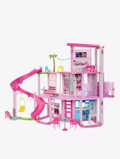 a pink doll house with a slide in the front and lots of furniture around it