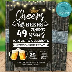 cheers and beers birthday party card with two mugs of beer on the wooden table