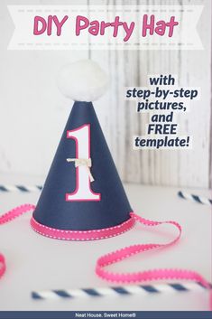 a party hat that has the number one on it and is blue with pink trim