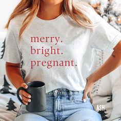 Christmas Pregnancy Announcement Shirt, Merry and Pregnant, Baby Reveal T-Shirt, Funny Pregnancy Tee, Christmas Maternity Shirts, Mom to Be At this time, we do not offer gift messaging, wrapping or notes, please send a separate card to your recipient if you are directly shipping a package. PLEASE NOTE For an oversized look, please size up! If you are looking for an oversized "T-shirt Dress" look, we recommend sizing up 2 sizes.Please review the size chart to ensure you receive the fit you want. Christmas Pregnancy Announcement Shirt, Christmas Pregnancy Reveal, Christmas Maternity Shirt, Christmas Maternity, Maternity Shirts, Pregnant Baby, Pregnancy Reveal Shirt, Funny Pregnancy, Christmas Pregnancy Announcement