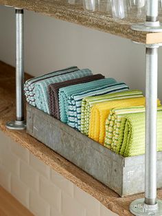 a shelf with towels and other items on it for sale at the store in farmhouse finds