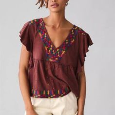 Anthropologie Embroidered Ruffle-Sleeve Peplum Blouse Top Brown Large Petite V-neck Top With Geometric Embroidery For Fall, Cotton Blouse With Flutter Sleeves For Fall, Bohemian Ruffle Tops With Flutter Sleeves, Chic Multicolor Tops With Floral Embroidery, Chic Multicolor Top With Floral Embroidery, Chic Multicolor Floral Embroidered Tops, Bohemian Cotton Tops With Ruffle Sleeves, Bohemian Short Sleeve Blouse With Ruffles, Bohemian Cotton Top With Ruffle Sleeves