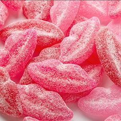 powdered sugar hearts on a white plate with pink frosting and sprinkles